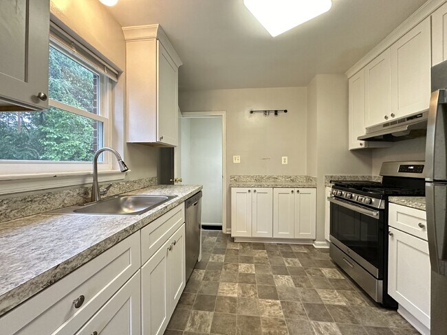 This classic brick rambler, located just around the corner from the West Falls Church Metro Stati...