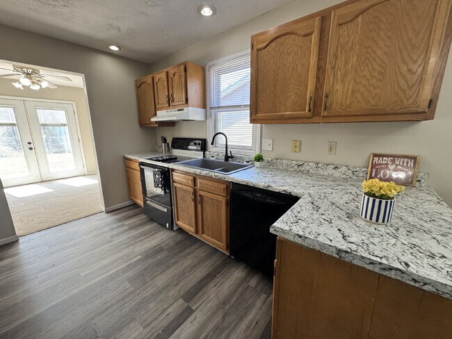 Photo - Modern Comfort: 3 Bed, 2 Bath Home with Fireplace and Fenced Backyard