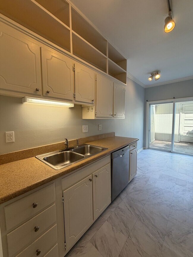 Photo - Prime Quail Hollow location! End-unit townhome with private patio, pool access, and HOA-covered m...