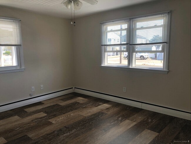 Living Area Showing Example of New LVP Flooring (Photo of downstairs unit with same layout) - 109 W Brigantine Ave Unit 6