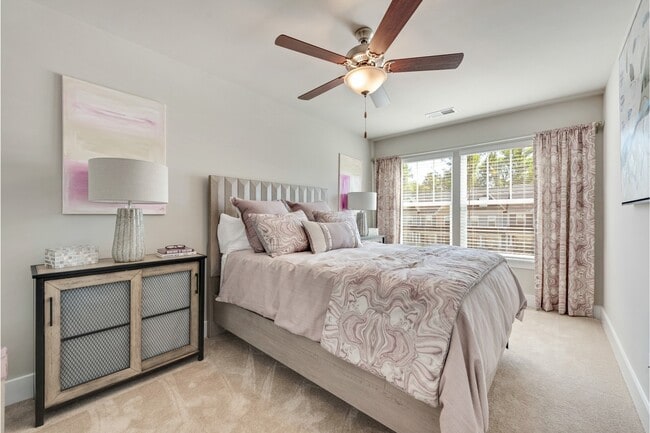 Bedroom with Plush Carpeting and Ceiling Fan with Light