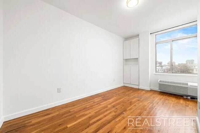 Photo - Modern 2-Bedroom Apartment with Private Balcony in Prime Bushwick Unidad 5A