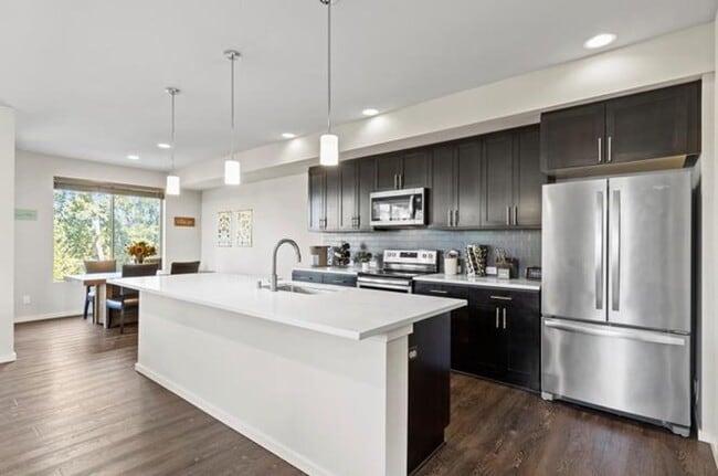 Photo - Spacious 4BR End-Unit Townhome + Bonus/Flex Room | A/C | Garage | Greenbelt Views