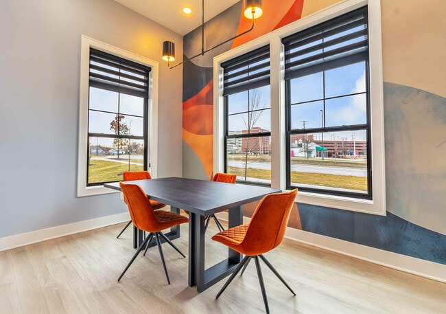 Experience modern elegance in this stylish dining nook, perfect for intimate gatherings. - Colony Lofts