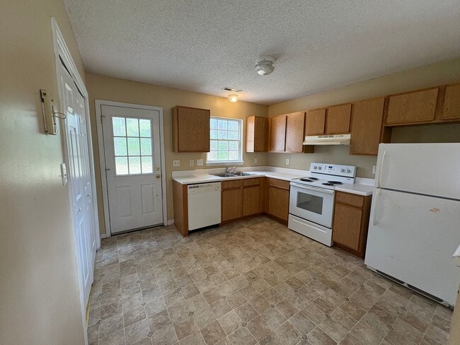 Photo - Charming two bedroom two bath town home that is set on an end unit. This home is just minutes fro...