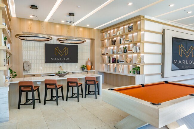 Modern Lounge with Sleek Bar Seating and Pool Table