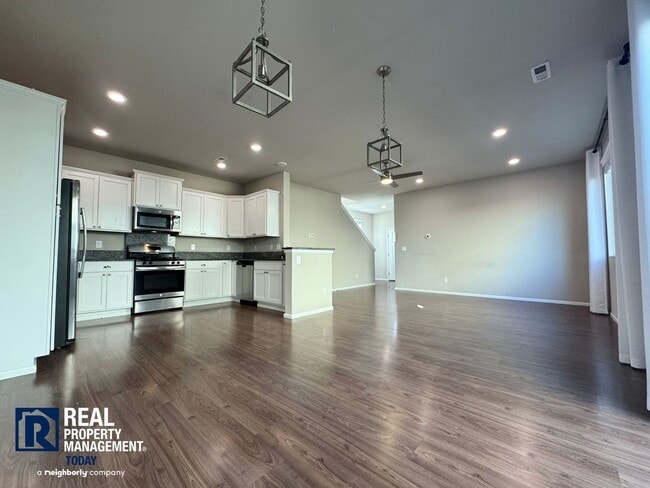 Photo - Spacious 4-Bedroom Home with Fenced Yard & 2-Car Garage Near JBLM!