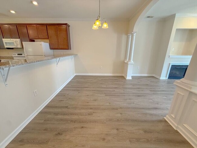 Photo - Beautifully updated Townhome! New cabinets, granite counter tops, and LVP flooring through downst...
