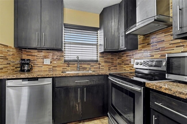 Building Photo - 6650 Royal Palm Blvd Unit 204C204C