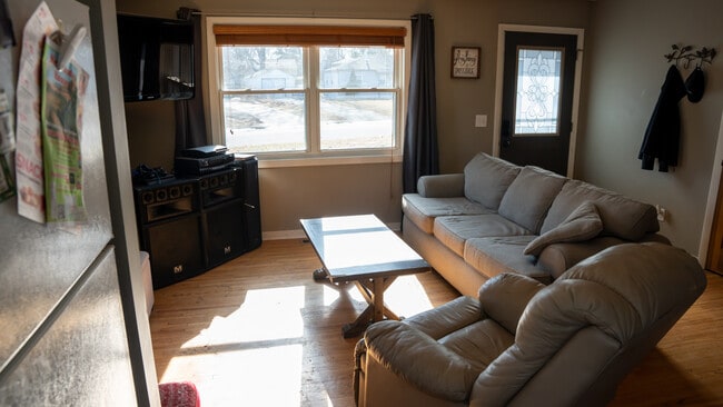 Living Room 1 - 5864 Quebec Ave N House Unit A - Master Bedroom