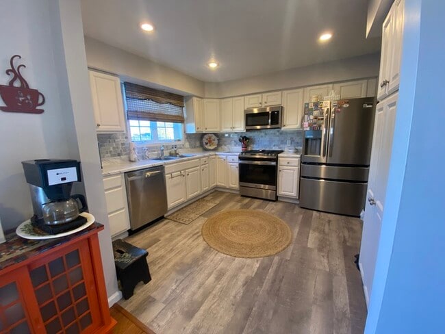 Photo - Gorgeous 3 bedroom 2.5 bath with one stall detached garage and fenced in backyard for rent!