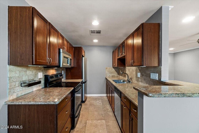 Building Photo - 4120 N 78th St Unit 218