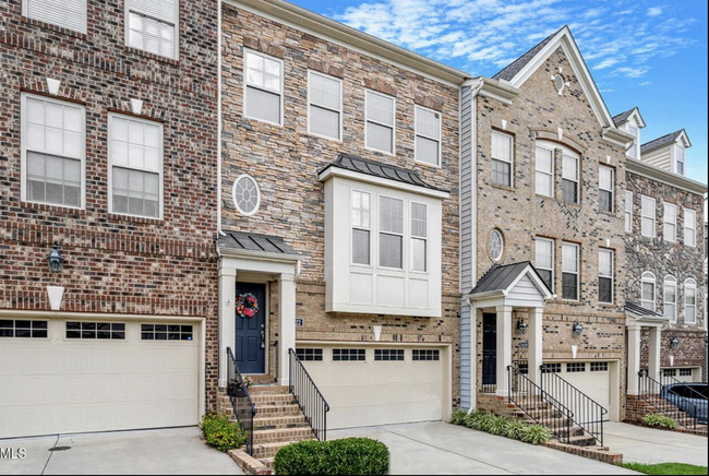 2-car garage with extra parking across - 8122 Primanti Blvd Townhome