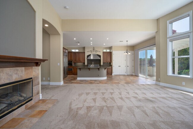 Convenient open floor plan integrates the kitchen and family room with incredible mountain views. - 2850 Bronzino Ct