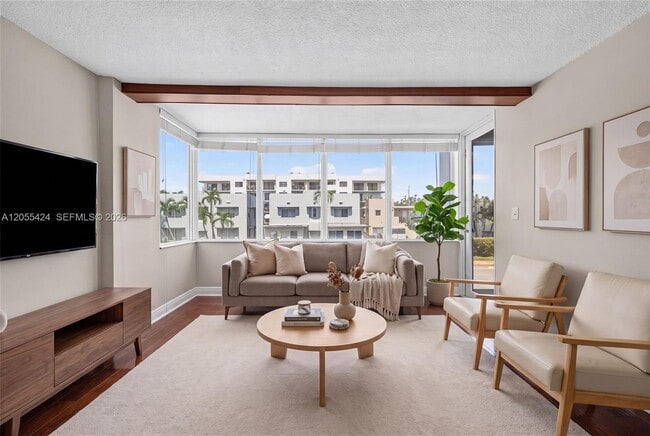 Building Photo - 8233 Harding Ave Unit 208