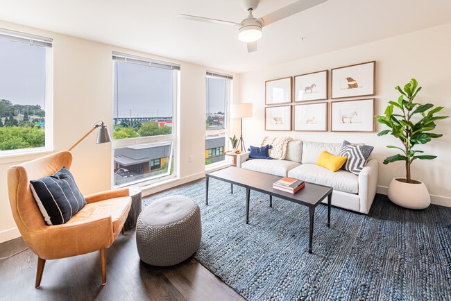 Living Room with Floor to Ceiling Windows, Ceiling Fan, and Spacious Layout