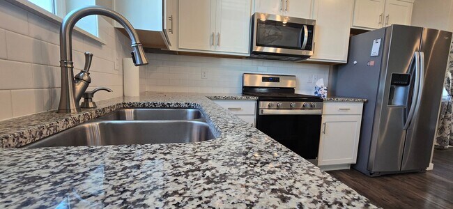 Photo - Discover this spacious 4-bedroom, 2.5-bath home in Mead, CO!