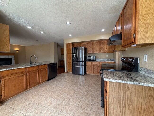 Photo - ~Available Now~ Beautiful Four Bedroom Home with Fireplace, Private Yard & Luxurious Primary Suite!