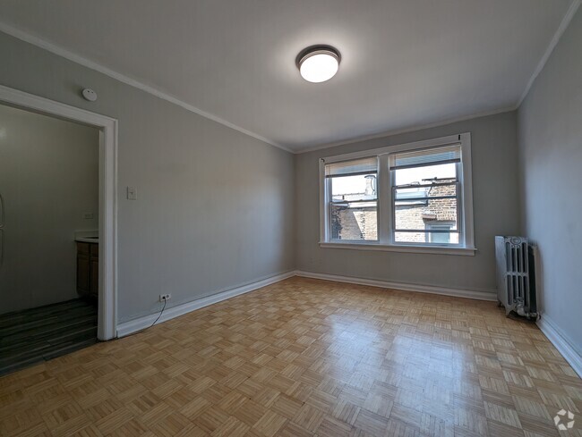 Building Photo - 717 W Belmont Ave Unit 409 Rental