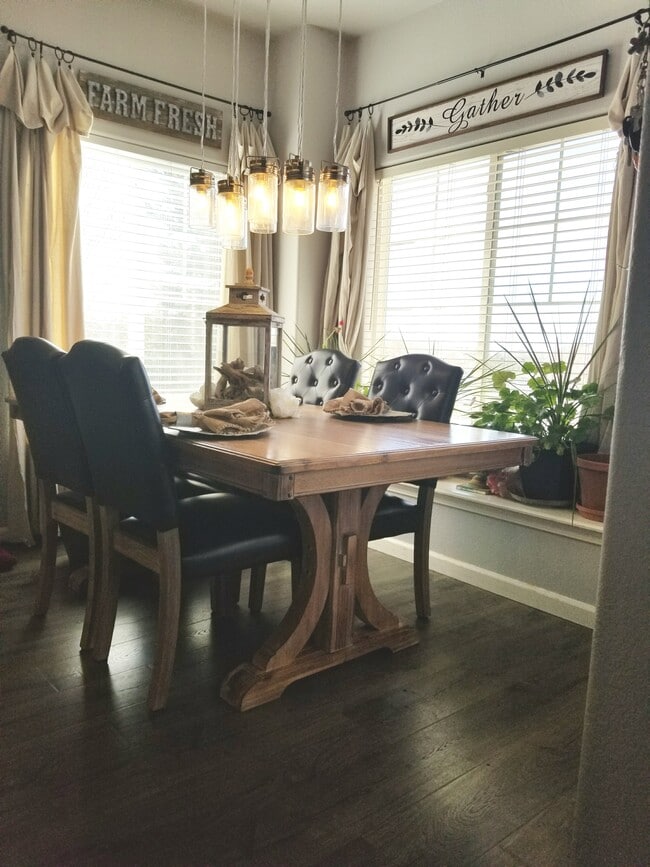 Dining room. Lots of natural light! Door exits to patio with views of Pikes Peak. - 6964 ASH CREEK HTS Apartments