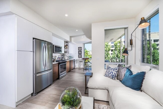 Bright kitchen with moveable island option and elegant open-shelving design.