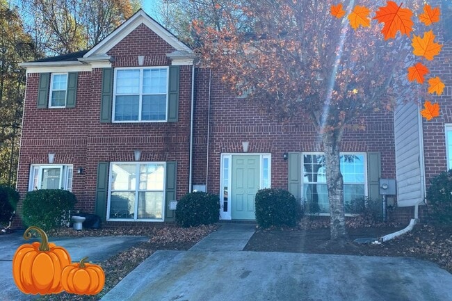 Building Photo - Welcome to this charming brick townhome in...