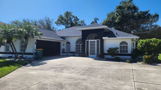 Building Photo - Fresh Paint, New Floors, and a Heated Pool...