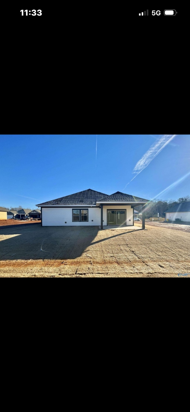 Photo - "NEWLY BUILT- Spacious 4-Bedroom Haven with Granite Elegance and Cozy Fireplace in Harvest"
