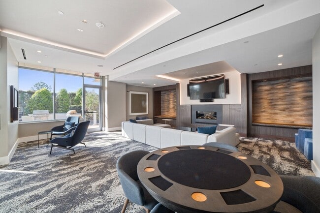 Settle in for game night with a poker table, sectional seating, and terrace views