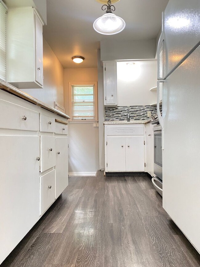 Photo - Beautiful 3 bed 1 bath house, over sized driveway, garage and fenced in back yard $1,795