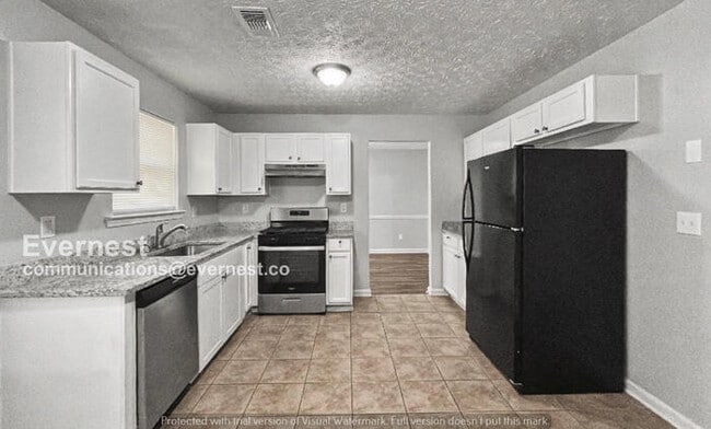 Photo - 3 Bed, 2 Bath Home with Fenced Yard & Garage / Pet-Friendly / Available Now!