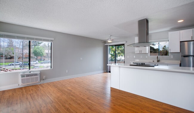 Dining room and living room are adjacent to the kitchen
