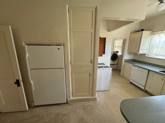 Photo - 4 Br, 2 Ba with kitchen appliances and bas...
