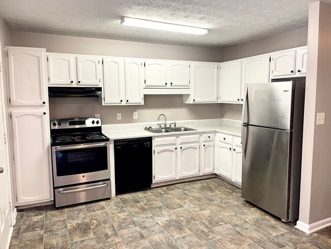 Photo - Welcome to this charming 2-bedroom, 2-bathroom townhouse located in the heart of Fayetteville, GA.