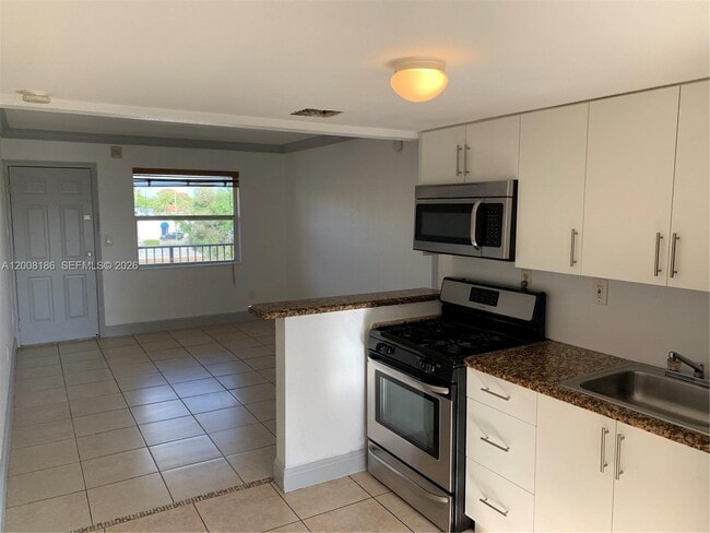 Building Photo - 241 S Royal Poinciana Blvd Unit 310