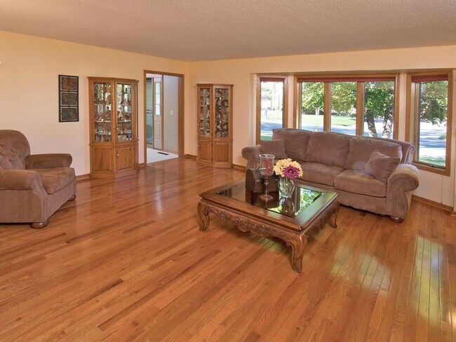 Photo - Elegant 2-Story has 4 BRs on Upper Level, Office, 2 Family Rooms, Fireplace & More!