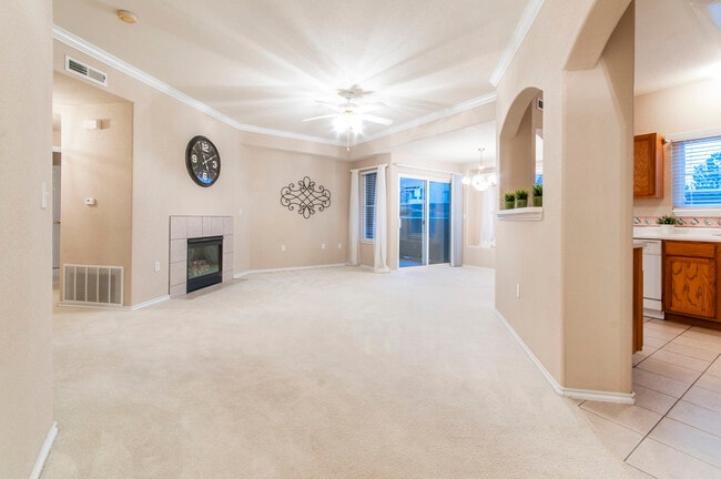 The living room has many windows provide natural light and good air circulation - 3960 Riviera Grove Unit 101