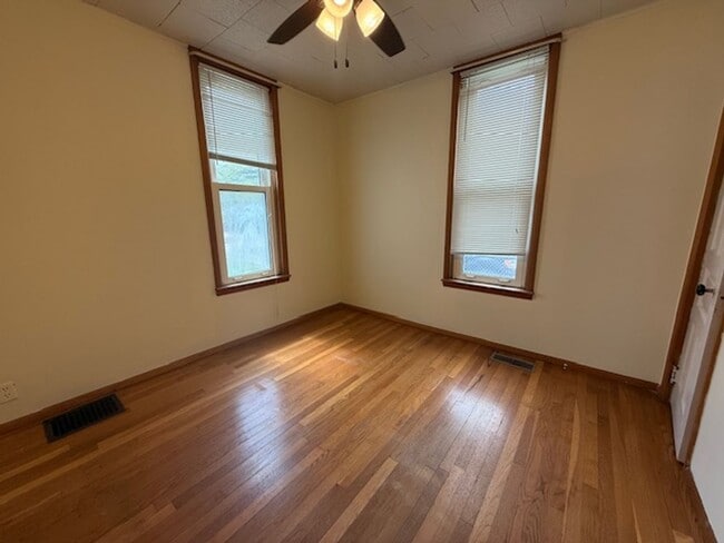 Photo - Classic Hardwood Floors, Fenced Yard & 2-Car Garage