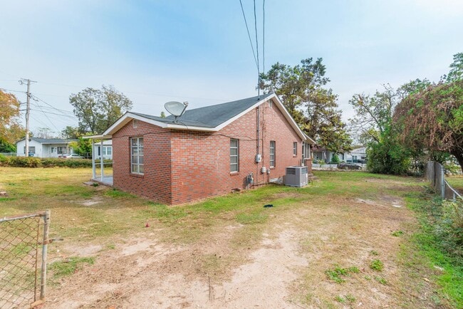Photo - Brick home with a fenced-in yard! Section ...
