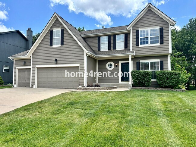 Photo - Beautiful Four-Bedroom Home with Three Car Garage, Wood Floors, Finished Basement and a Fenced Ya...