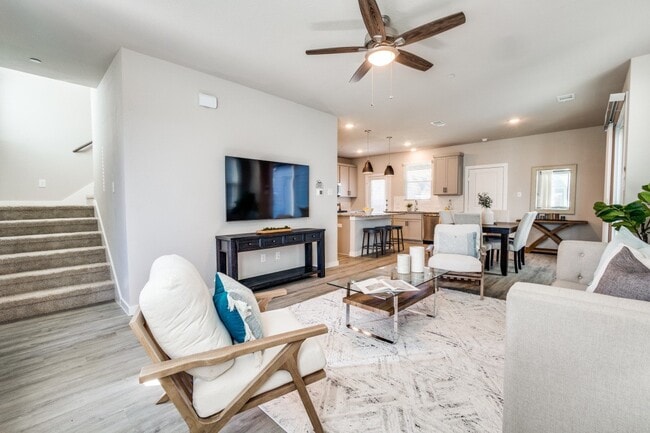 Bright, open living room with modern furnishings in a single-family home - Canvas at Denton