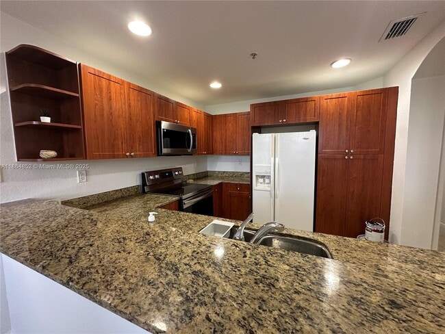 Building Photo - 10805 NW 89th Terrace Unit 207-4 Rental