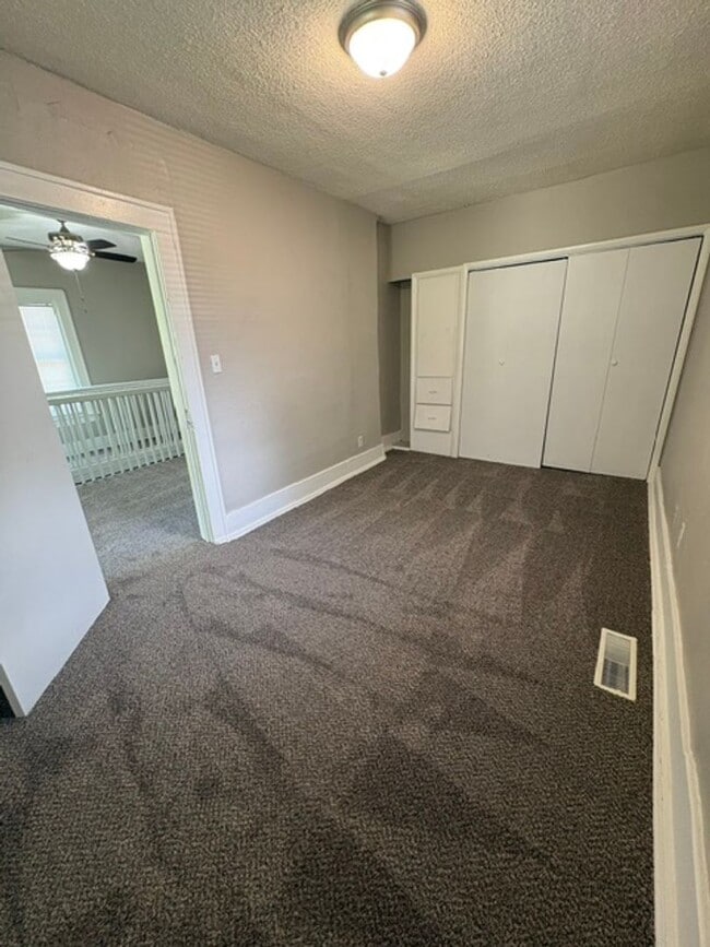 Photo - A cozy 2 bedroom home with versatile living space and plenty of storage including a partially fin...