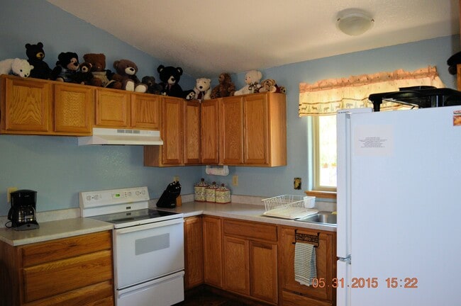 Kitchen. Includes coffee maker, microwave, toaster oven, dishes, pans, silverware, cooking utensils. - 24771 Amber Drive Unit 2BR Apartment