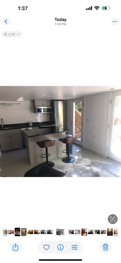 open kitchen/livingroom with sliding glass doors into patio - 524 E 6th Ave (Salt Lake City, UT)