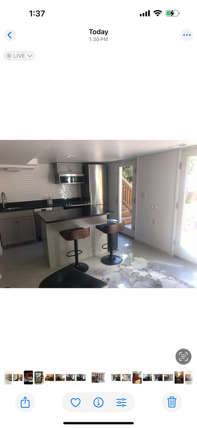 open kitchen/livingroom with sliding glass doors into patio - 524 E 6th Ave Apartamentos