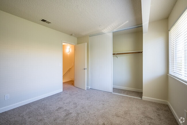 2BR, 1.5BA - 850SF - Primary Bedroom - Mission Village Apartments