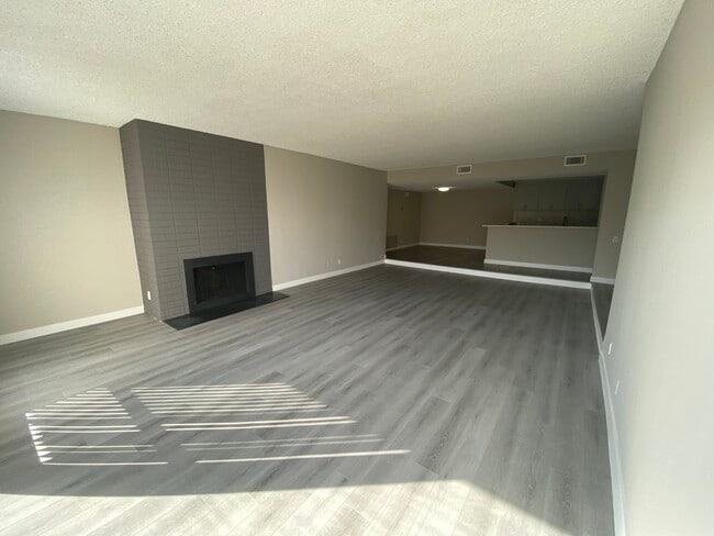 11858 Goshen Ave Unit 207 living room with fireplace