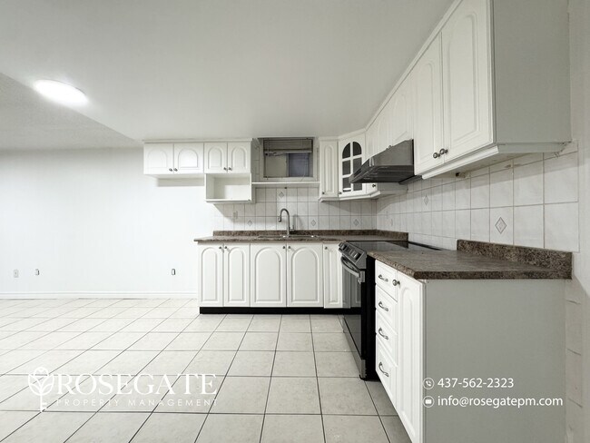 Photo - Spacious 2-Bedroom Basement Apartment with... Unit 2