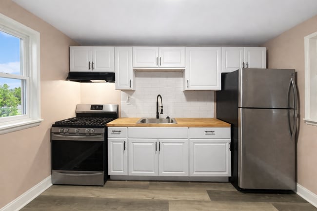 Photo - Renovated 3BR Rowhome with Central AC & Fenced Yard